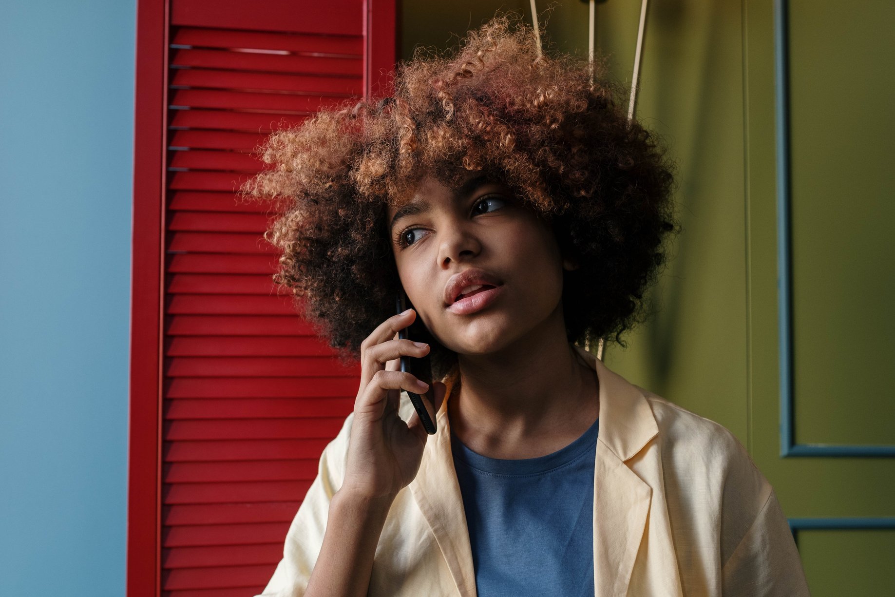 Close-Up Shot of a Woman Calling on Her Cellphone